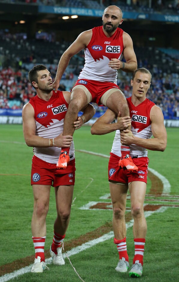 AFL 2015 First Semi Final - Sydney v North Melbourne SYDNEY, AUSTRALIA - SEPTEMBER 19: Rhyce Shaw of the Swans is chaired of after the 2015 AFL First Semi Final match between the Sydney Swans and the North Melbourne Kangaroos at ANZ Stadium, Sydney, Australia on September 19, 2015. (Photo by Craig Golding/AFL Media)